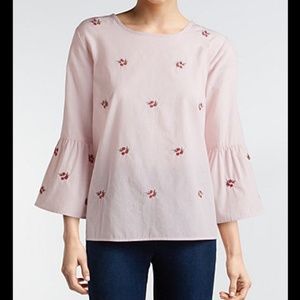 Light pink top with delicate flower design